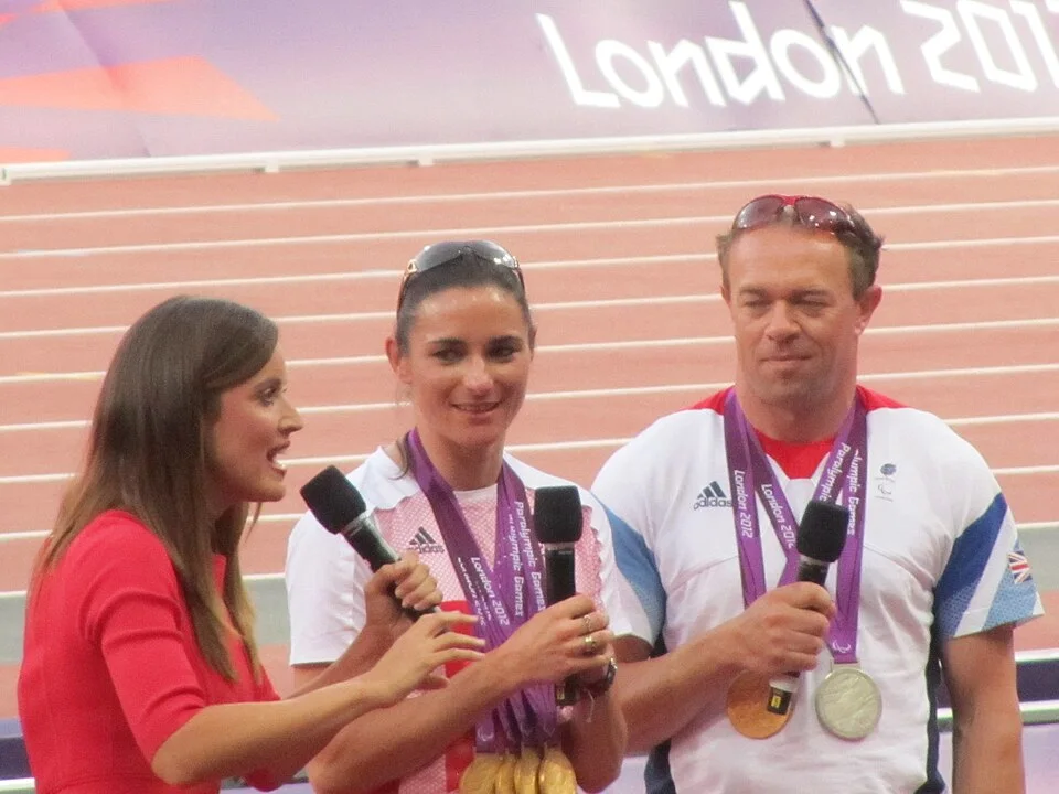 Sarah Storey and her husband Barney Storey being interviewed at the Olympic Stadium in 2012